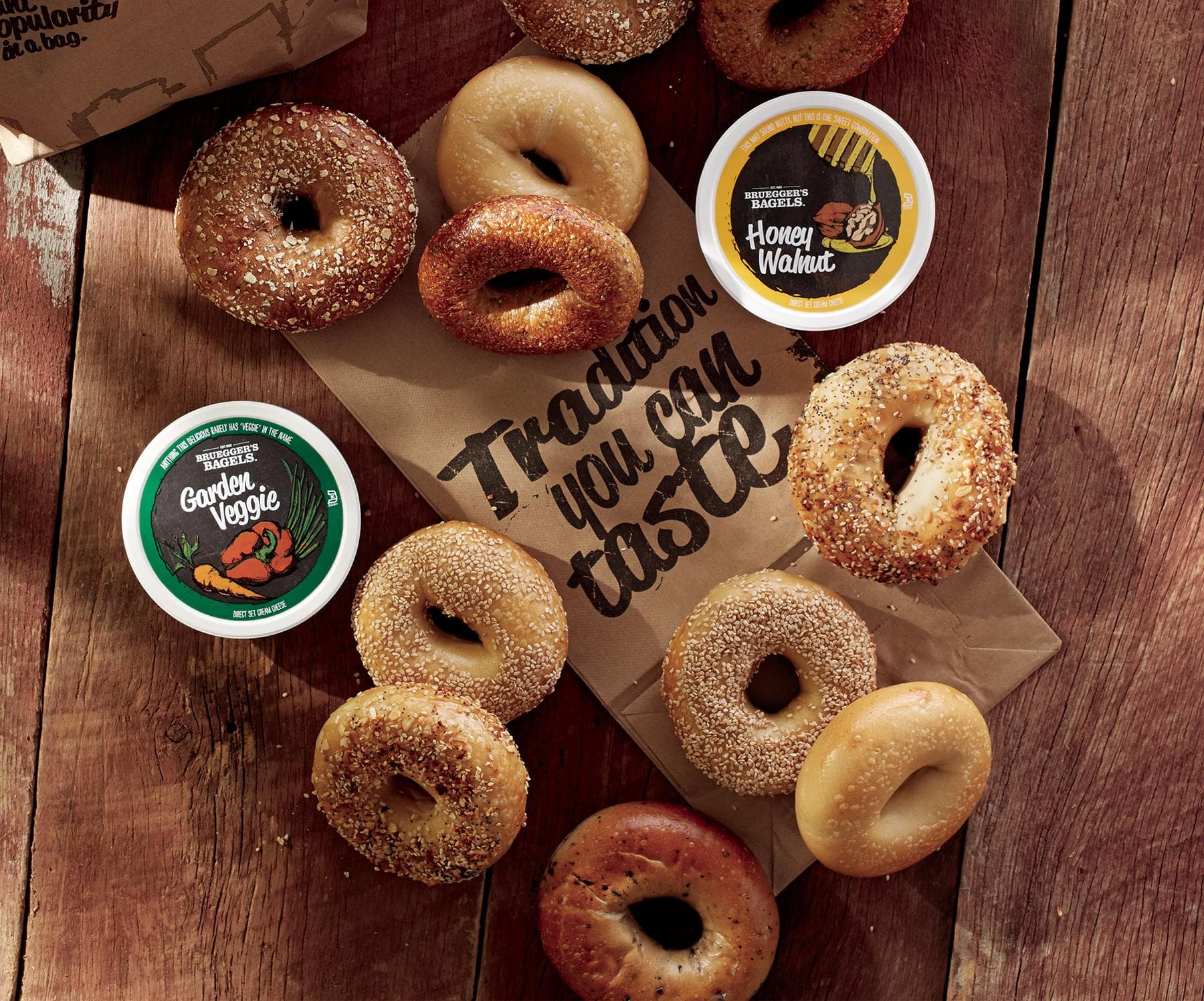Overhead spread of Brueggers bagels and cream cheese tubs