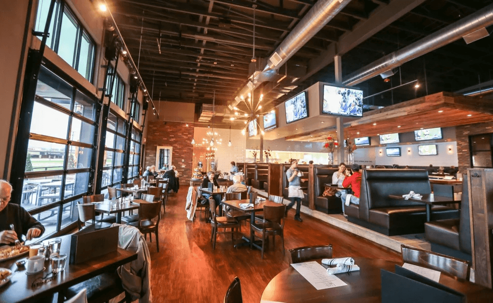 Five West open dining room with garage doors and booths