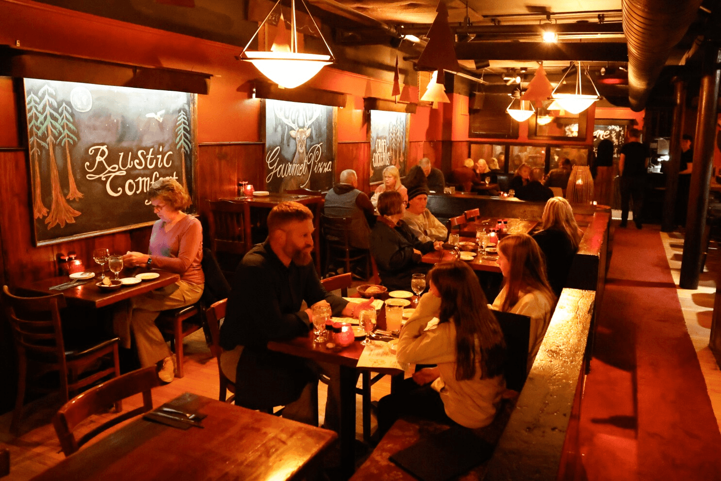 Redwood Room cozy basement dining room with warm lighting