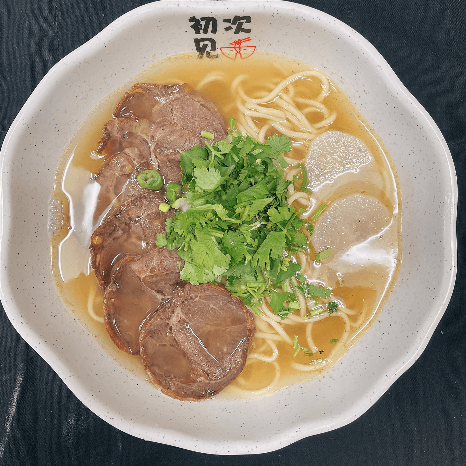 Bowl of beef noodle soup at First Meeting Noodle