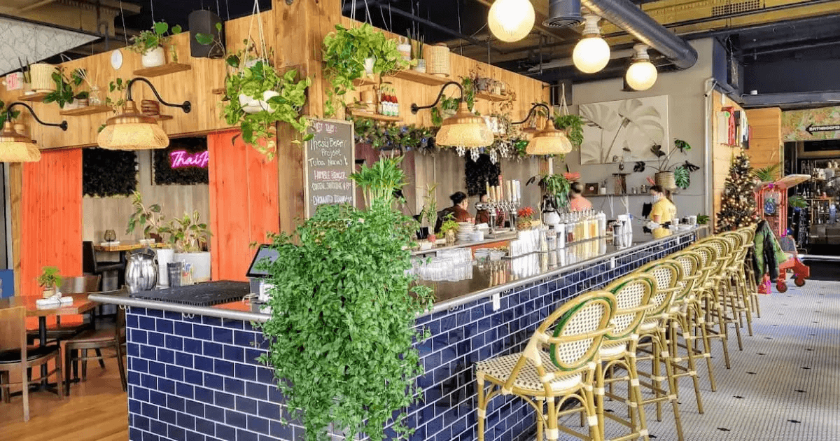 Plant-filled bar and dining room at Thai Pop